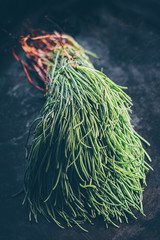 Agretti or barba di frate (saltwort). Rare seasonal ingredients of Italian cuisine