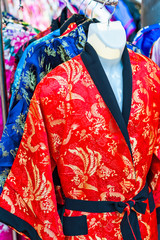 Sale of colorful kimonos on city street in Kyoto, Japan.