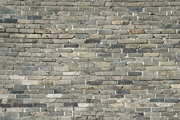 Stone wall texture background of grey brick stones.