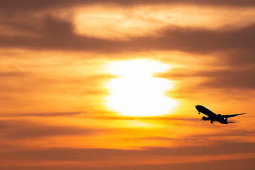 airplane taking off airport sky-diving industry cargo business, concept: passenger Commercial  modern navigable Travel and business,Silhouette aircraft is flying above skyline sun