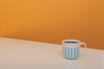 Obraz na płótnie Canvas minimalism concept of cup of coffee with copy space