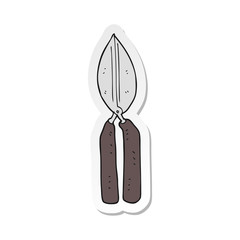 sticker of a cartoon shears