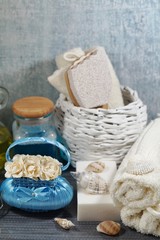 Fototapeta na wymiar Spa - Aromatic soap, scented bath salt, and oil, and accessories for massage and bathroom.