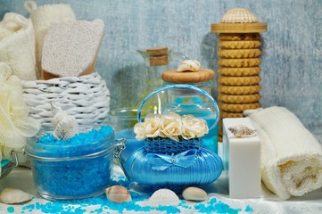 Fototapeta na wymiar Spa - Aromatic soap, scented bath salt, and oil, and accessories for massage and bathroom.