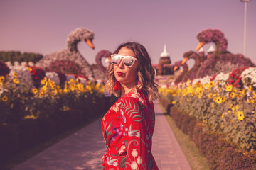 Fototapeta premium woman like a litte girl playing on the sun of dubai