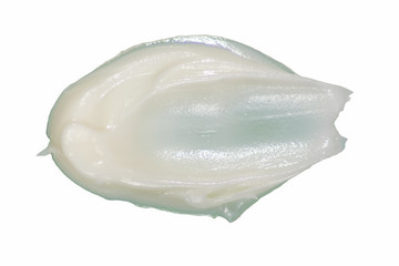 Cream on white. A sample of cosmetics. Smear cream for face.