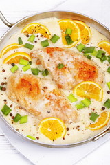 Chicken with lemons on white background