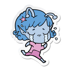 sticker of a cartoon crying alien girl