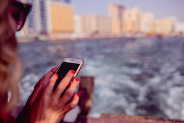 woman like a litte girl playing on the sun of dubai