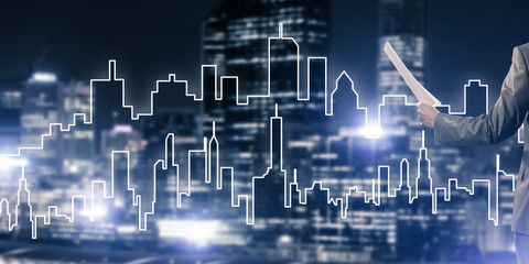 Man architect or engineer presenting construction concept and holding documents in hand