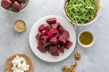 Ingredients ready for preparing beetroot salad with goat cheese and walnuts