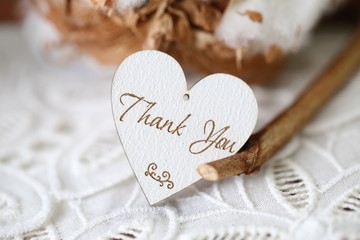 Fototapeta premium Wooden shaped heart with written word thank you on it