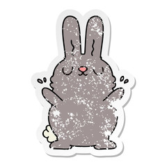 distressed sticker of a quirky hand drawn cartoon rabbit