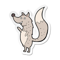 sticker of a cartoon waving wolf