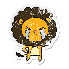 distressed sticker of a cartoon crying lion