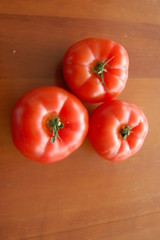 fresh tomatoes on a wooden board