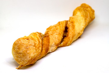 Puff pastry photo closeup on white background. Bakery studio photo. Warm fresh puff pastry closeup