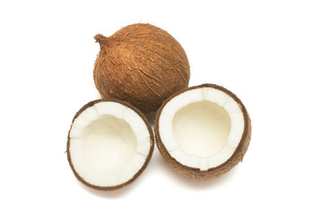 Coconuts whole and half isolated on white background. Tropical fruit. Flat lay, top view