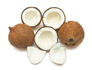 Coconuts whole, half and piece isolated on white background. Tropical fruit. Flat lay, top view
