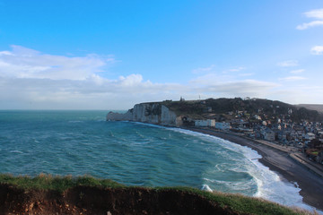 Picturesque panoramic landscape on the cliffs of Etretat. Natural amazing cliffs. Etretat, Normandy, France, La Manche or English Channel. Coast of the Pays de Caux area in sunny summer day 