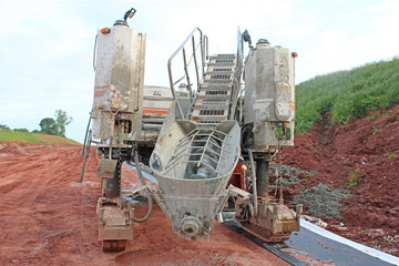 Concrete Paving machine on a road construction site