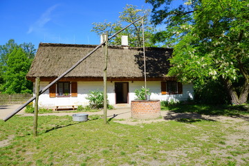 Fototapeta na wymiar Farm, white wooden buildings of the area of the museum - reconstruction of XX century 