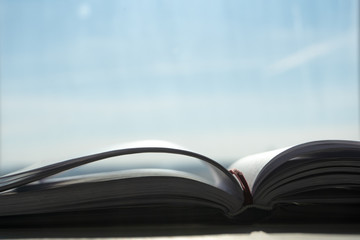 Notebook for studying on the desk in the morning sun. 