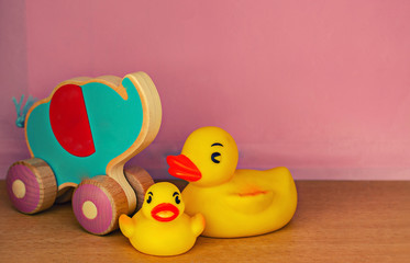 Kids toys on pink background