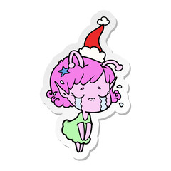 sticker cartoon of a crying alien girl wearing santa hat