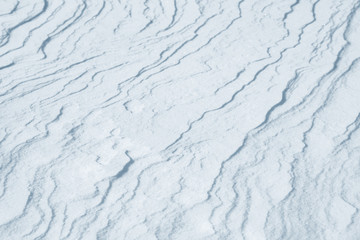 Fresh snow background texture. Winter background with snowflakes and snow mounds. Snow lumps.