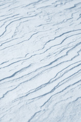 Fresh snow background texture. Winter background with snowflakes and snow mounds. Snow lumps.