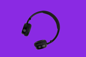 Black headphones isolated on trendy proton purple color background. Music minimal concept