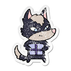 distressed sticker of a friendly cartoon wolf with gift