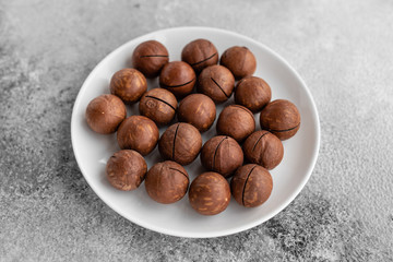 Macadamia nuts close up. Breakfast, healthy food. It can be used as a background