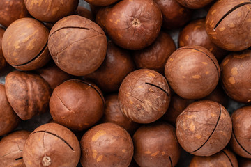 Macadamia nuts close up. Breakfast, healthy food. It can be used as a background
