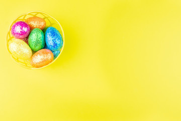 Easter eggs on yellow background