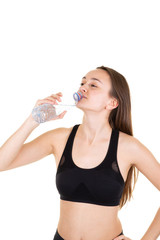 Woman sporty fitness drinking bottle of water