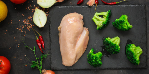 chicken breast, raw meat fillets and other ingredients (vegetables, celery, spices, mushrooms, etc.). food background. copy space