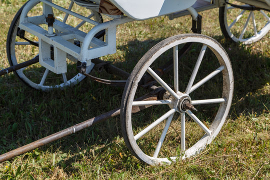 View of the metal wheels and springs of the old passenger carriage
