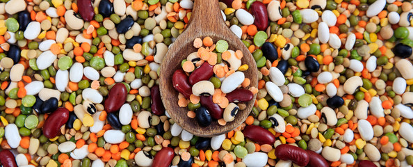 Mixed dry uncooked legumes full background, banner - obrazy, fototapety, plakaty