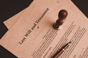 Notary's public pen and stamp on testament and last will. Notary public tools