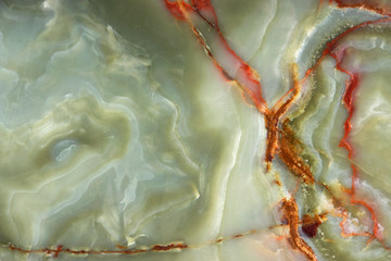 Obraz na płótnie Canvas Green onyx with red veins, the surface of natural stone