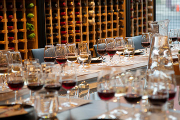 Wine glasses with red and white wine set on the table for wine tasting