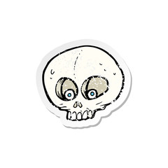 retro distressed sticker of a cartoon funny skull