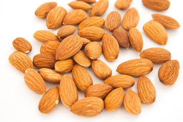 Almond superfood isolated on white background. Concept of healthy life. Close up. Nuts fill the whole frame