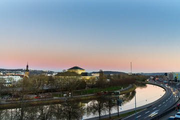 Germany, City saarbruecken behind saar river in dawning light