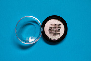 Artificial Magnetic False Eyelashes Tool on blue background