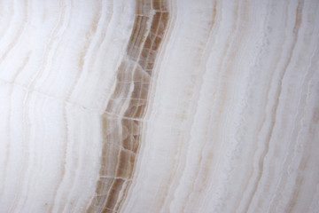 The stone is white with brown stripes called Onyx.