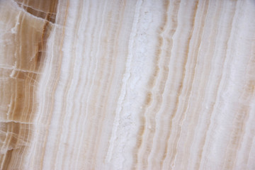 A beautiful white stone with brown stripes called Onyx.