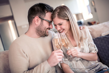 Couple drink wine at home